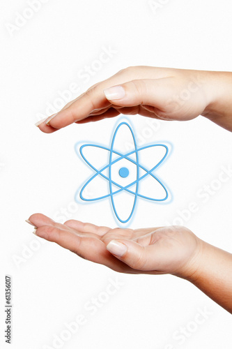Hands holding atom symbol