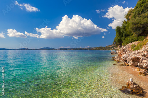 View to pebbles through transparent water sea floor