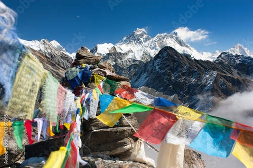 view of everest from gokyo ri with prayer flags