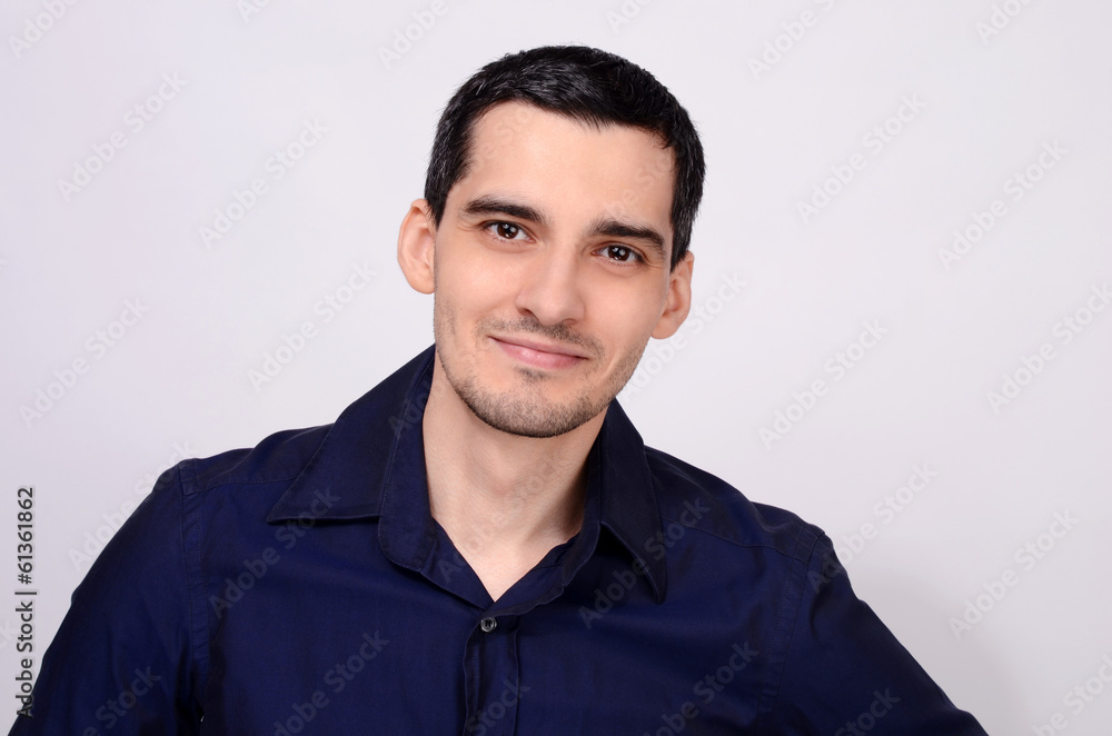 Portrait of a young happy business man smiling. Portrait of a young happy business man smiling.