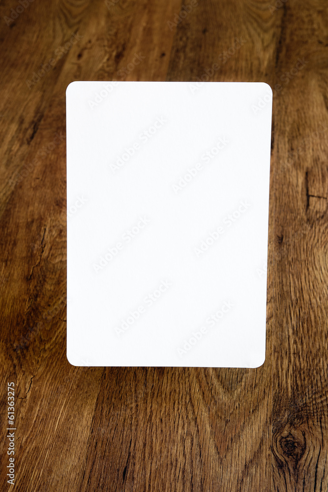 Sheet of paper with rounded borders with wooden background Sheet of paper with rounded borders with wooden background