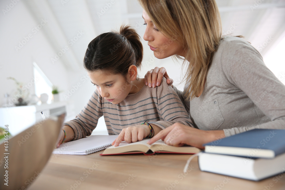 Mom helping kid with homework Mom helping kid with homework