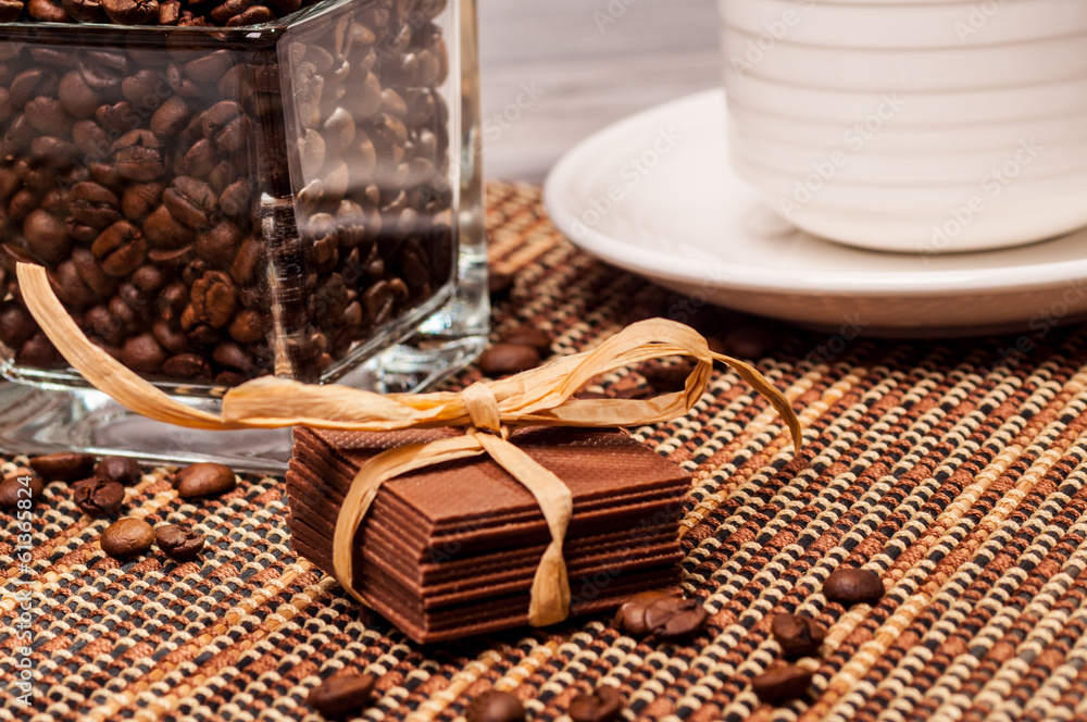 Fototapeta premium Chocolate with a paper ribbon and coffee