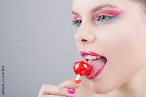 girl eating a lollipop