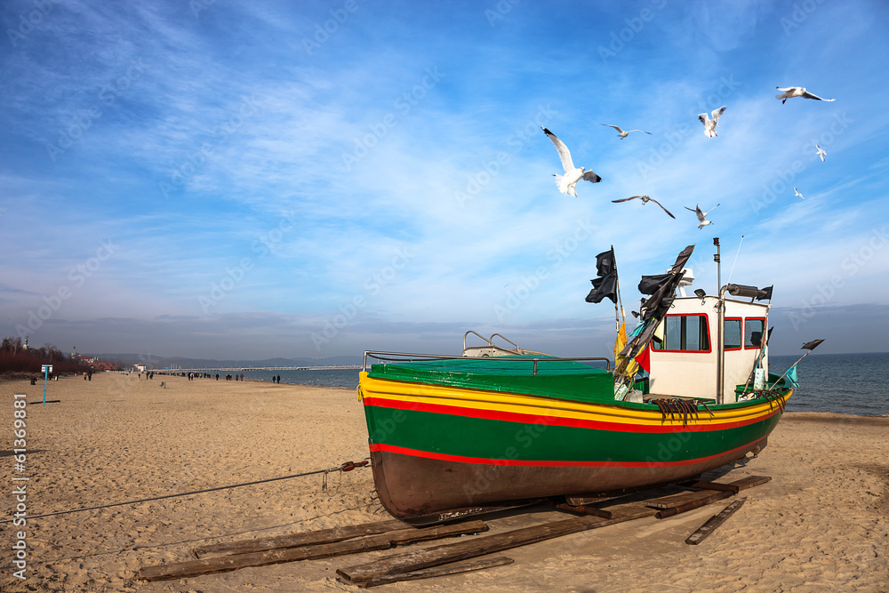 Fototapeta premium Fishing boat on the beach in Sopot, Poland.