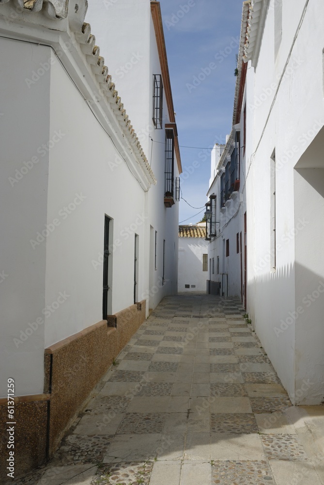 White Andalusian alley in Carmona, Spain