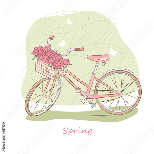 Pink bicycle with basket of flowers