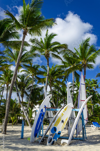 Surfboard on the sandy Caribbean beach in Dominican Republic