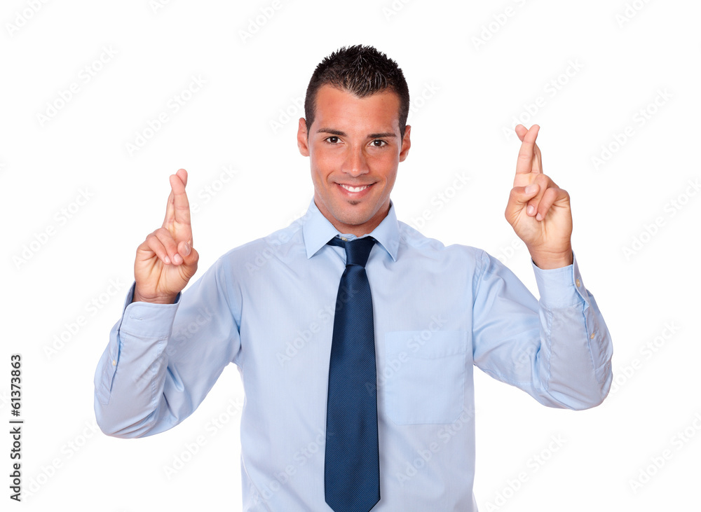 Attractive young businessman crossing his fingers Attractive young businessman crossing his fingers