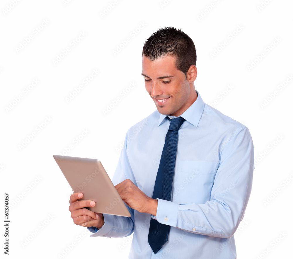 Cute guy working with his tablet pc Cute guy working with his tablet pc