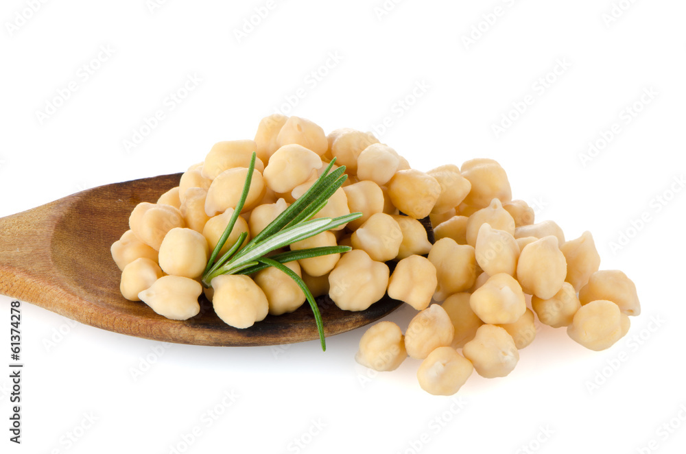 Chickpeas over wooden spoon Chickpeas over wooden spoon