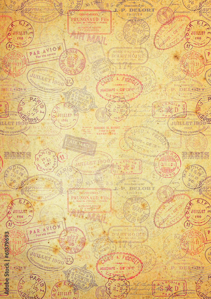 grungy paper background with vintage postage stamps