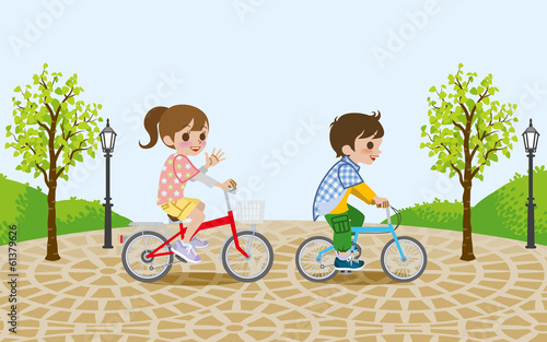 Two kids riding Bicycle, in the park