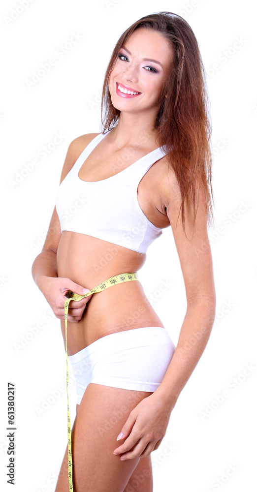 Beautiful young woman measuring her body with tape isolated Beautiful young woman measuring her body with tape isolated