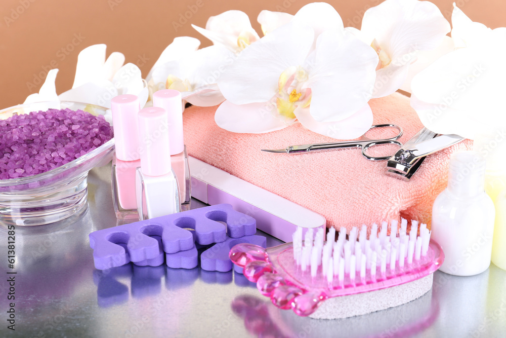 Pedicure set on table on beige background Pedicure set on table on beige background