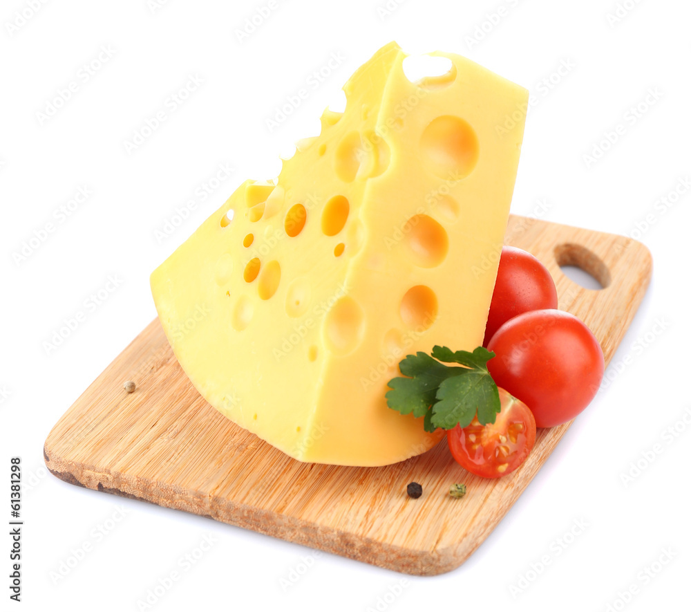 Piece of cheese and tomatoes, on wooden board, isolated on