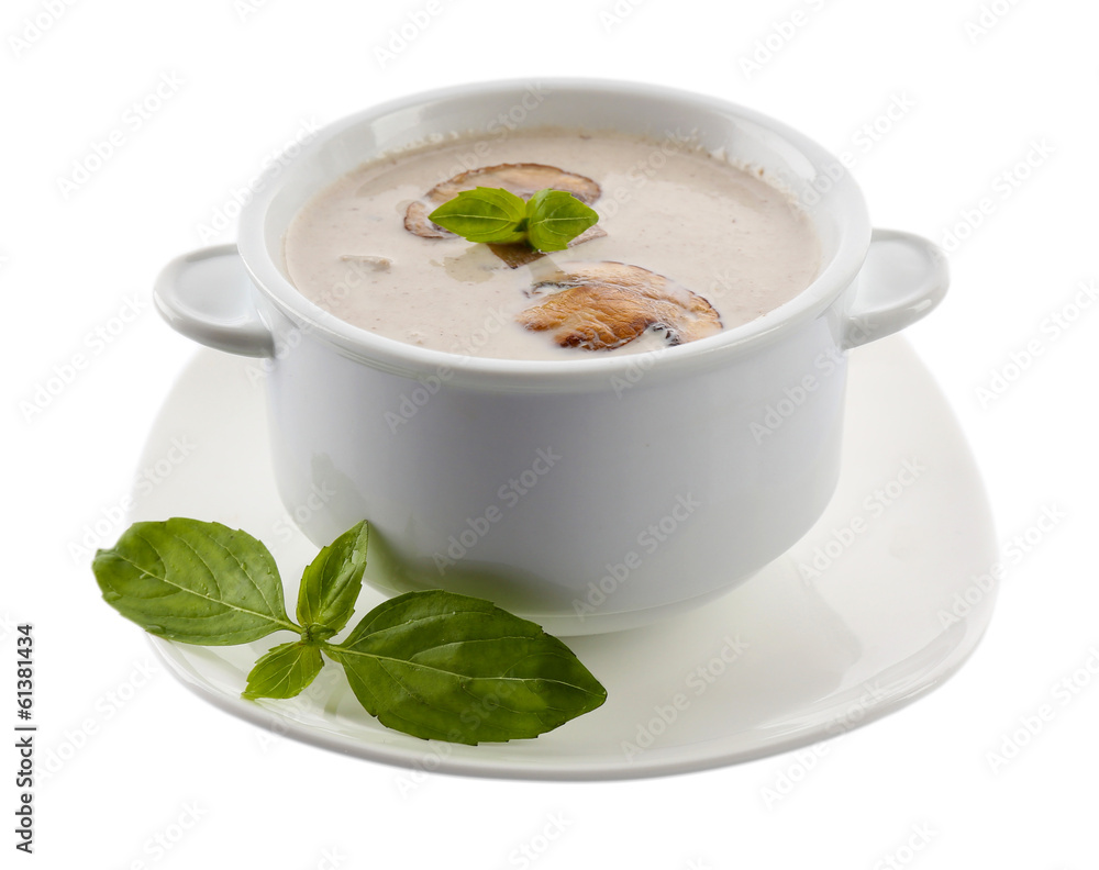 Mushroom soup in white bowl, on plate, isolated on white Mushroom soup in white bowl, on plate, isolated on white