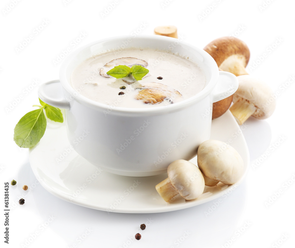 Mushroom soup in white bowl, on plate, isolated on white Mushroom soup in white bowl, on plate, isolated on white