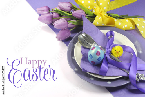 Happy Easter yellow and purple table setting with greeting
