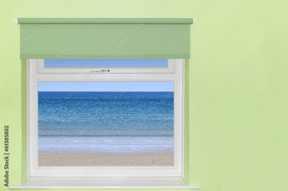 View of blue sky and beach from window View of blue sky and beach from window