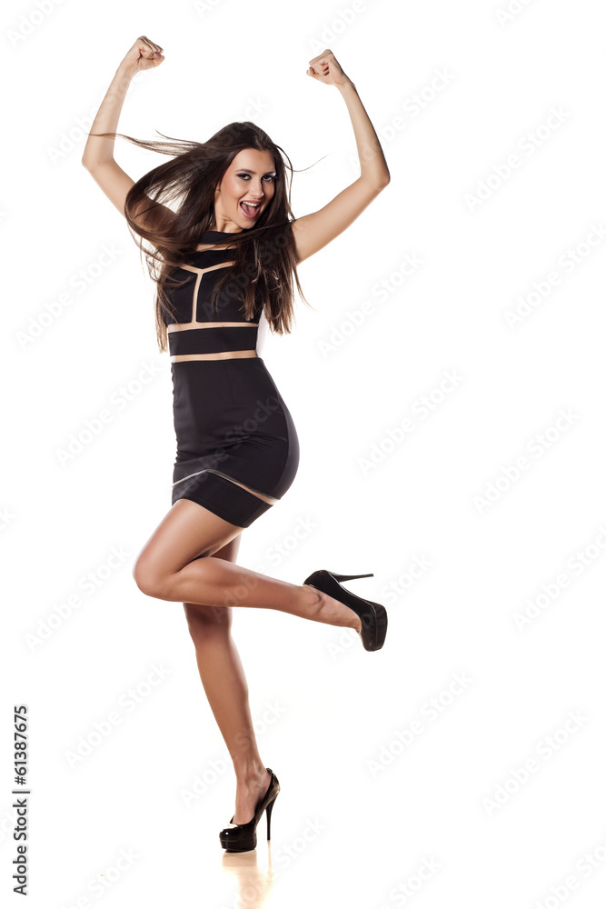 very happy pretty young woman jumping on white background