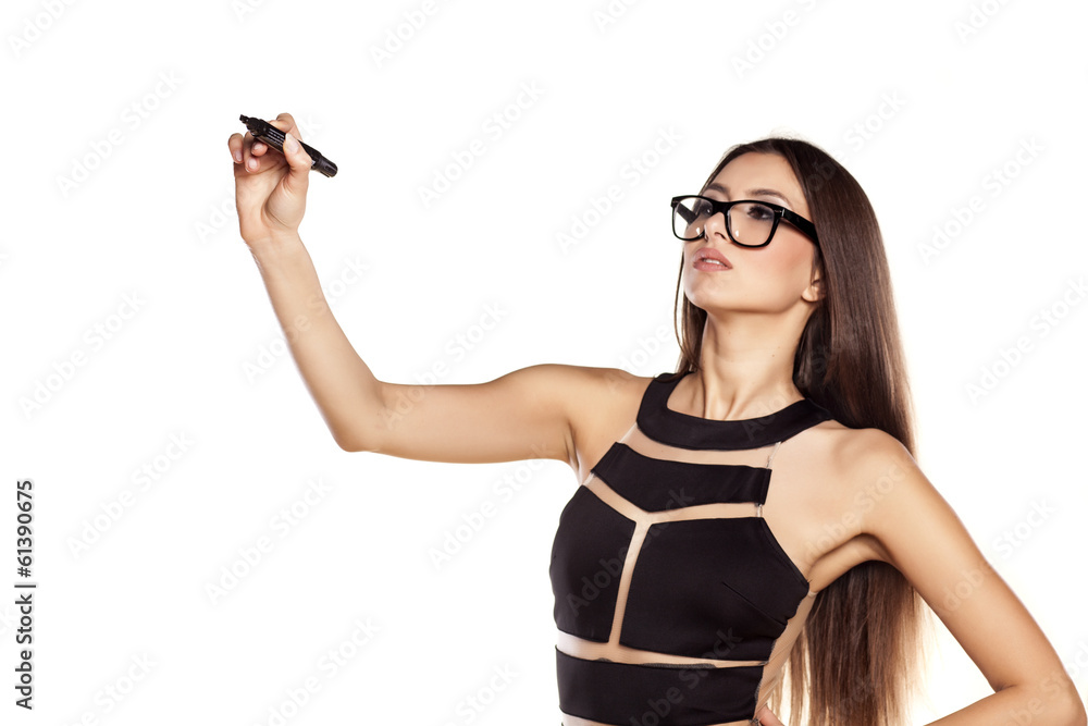 © vladimirfloyd - woman with glasses writing with a marker in the empty space