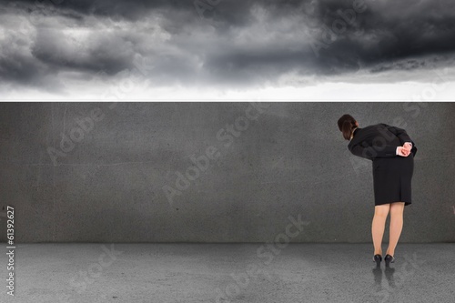 Composite image of businesswoman bending © WavebreakmediaMicro