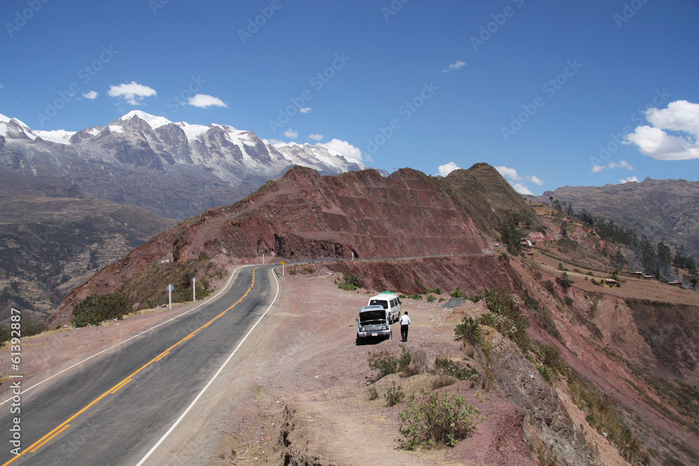 Car stop at the mountain road in South America