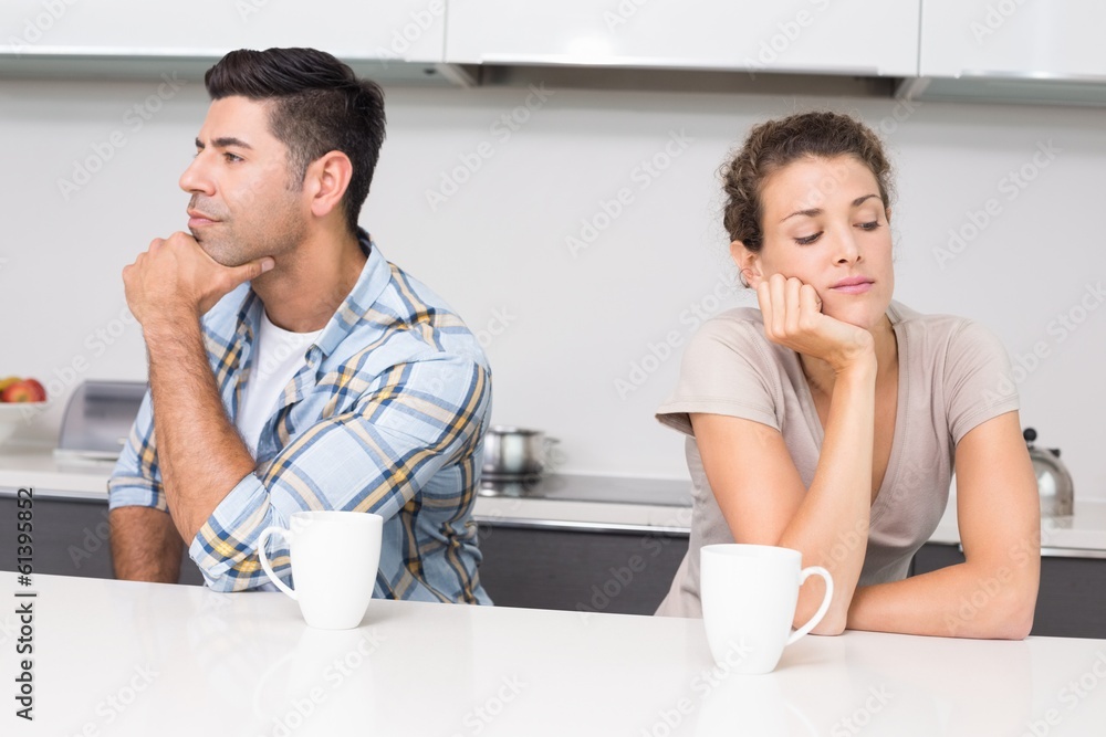 Unhappy couple having coffee not talking Unhappy couple having coffee not talking