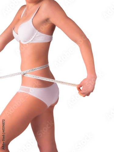 Diet concept. Woman measuring her waist, isolated 