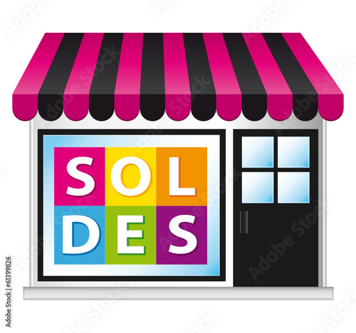 Petite boutique. Affichage soldes sur la vitrine.