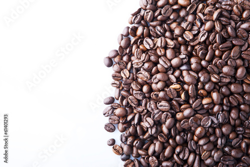 Roasted coffee beans pile from top on white background