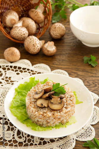 Buckwheat porridge with mushrooms on plate