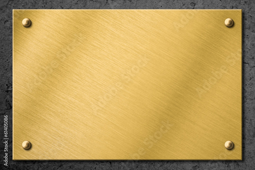 golden or brass metal plate or signboard on wall background