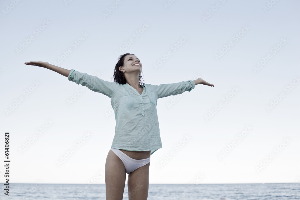 Young woman enjoying summer rest at the seaside. Young woman enjoying summer rest at the seaside.