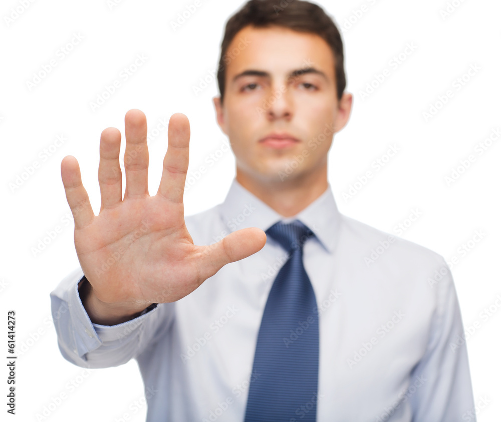 attractive buisnessman making stop gesture attractive buisnessman making stop gesture