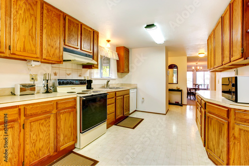 White kitchen with wooden storage combination