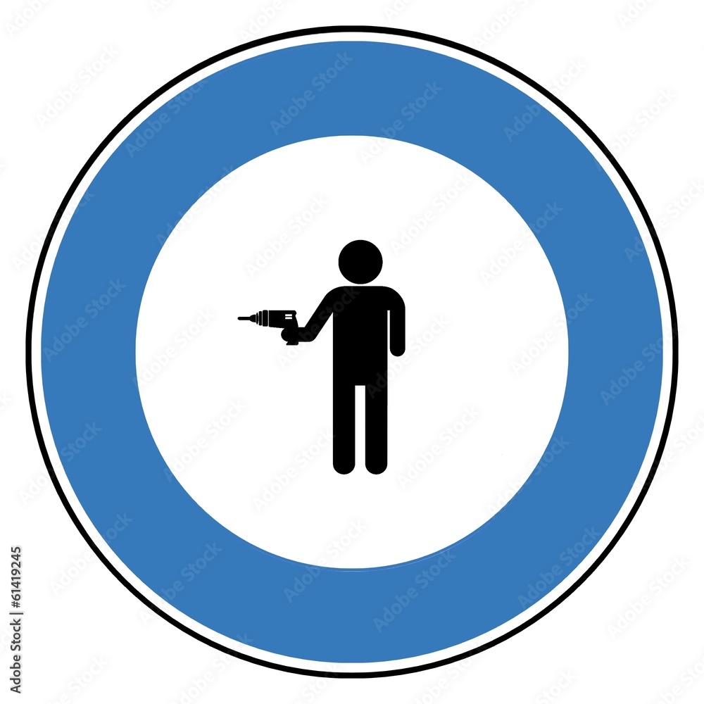 Homme avec une perceuse dans un panneau Homme avec une perceuse dans un panneau