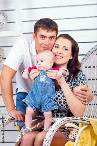 Family. Beautiful happy couple with small child. photo