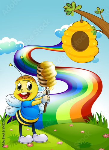 A bee at the hilltop with a rainbow in the sky