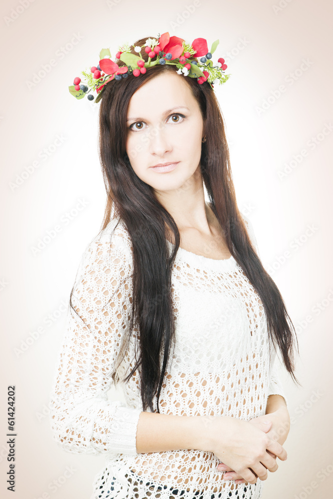 Young beautiful woman with flower wreath on head Young beautiful woman with flower wreath on head