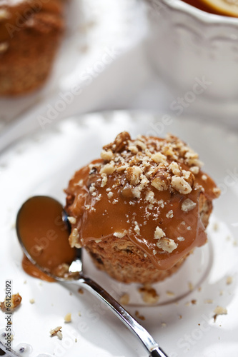Muffin with caramel frosting and nuts