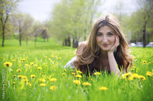 Beautiful young girl in meadow