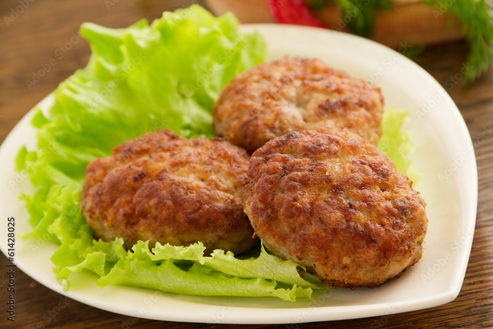 Large fried cutlets with lettuce Large fried cutlets with lettuce