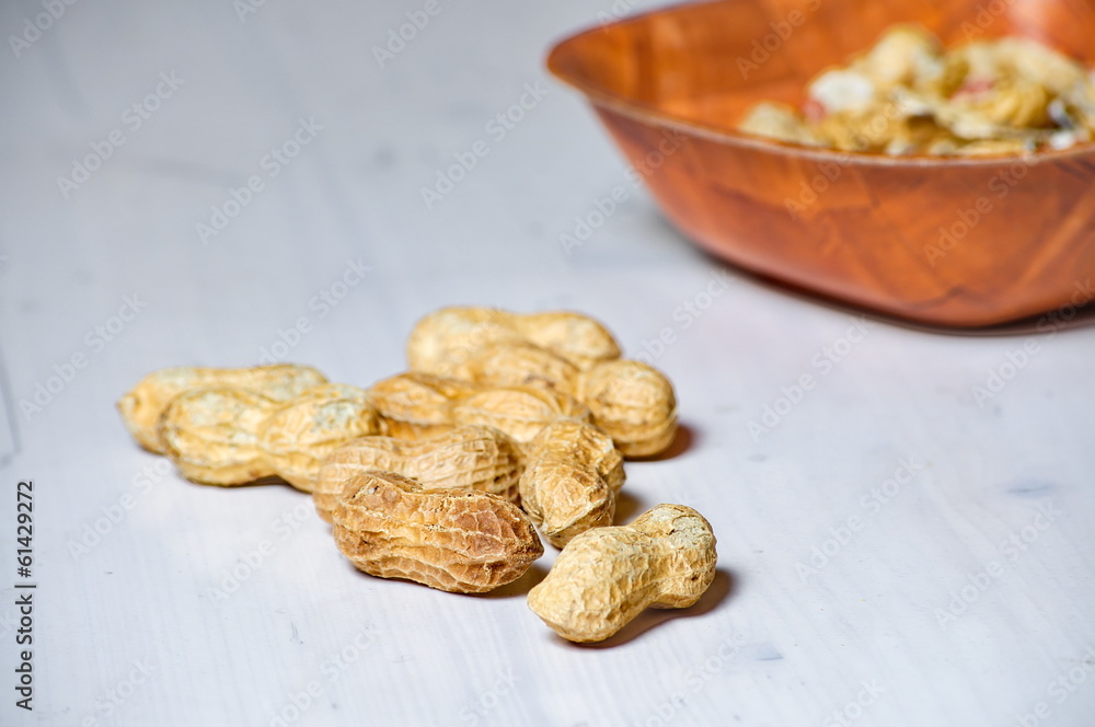Peanuts in a brown bowl Peanuts in a brown bowl