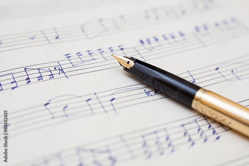 pen and music sheet with handwritten notes pen and music sheet with handwritten notes