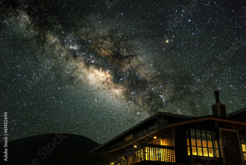 The Milky Way over a mountain house.