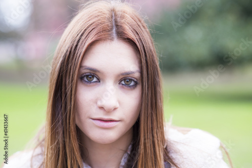 Portrait of attractive brunette young girl, outdoor.