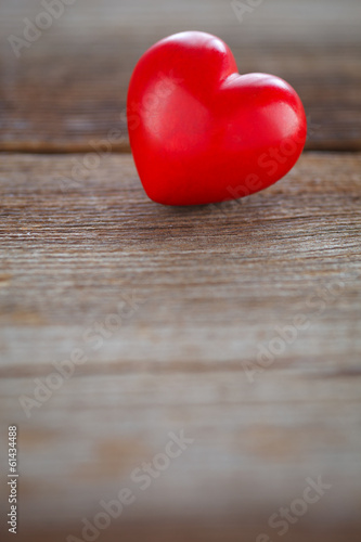 red heart on wooden board