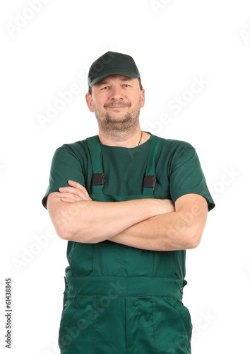 Worker in green overalls.